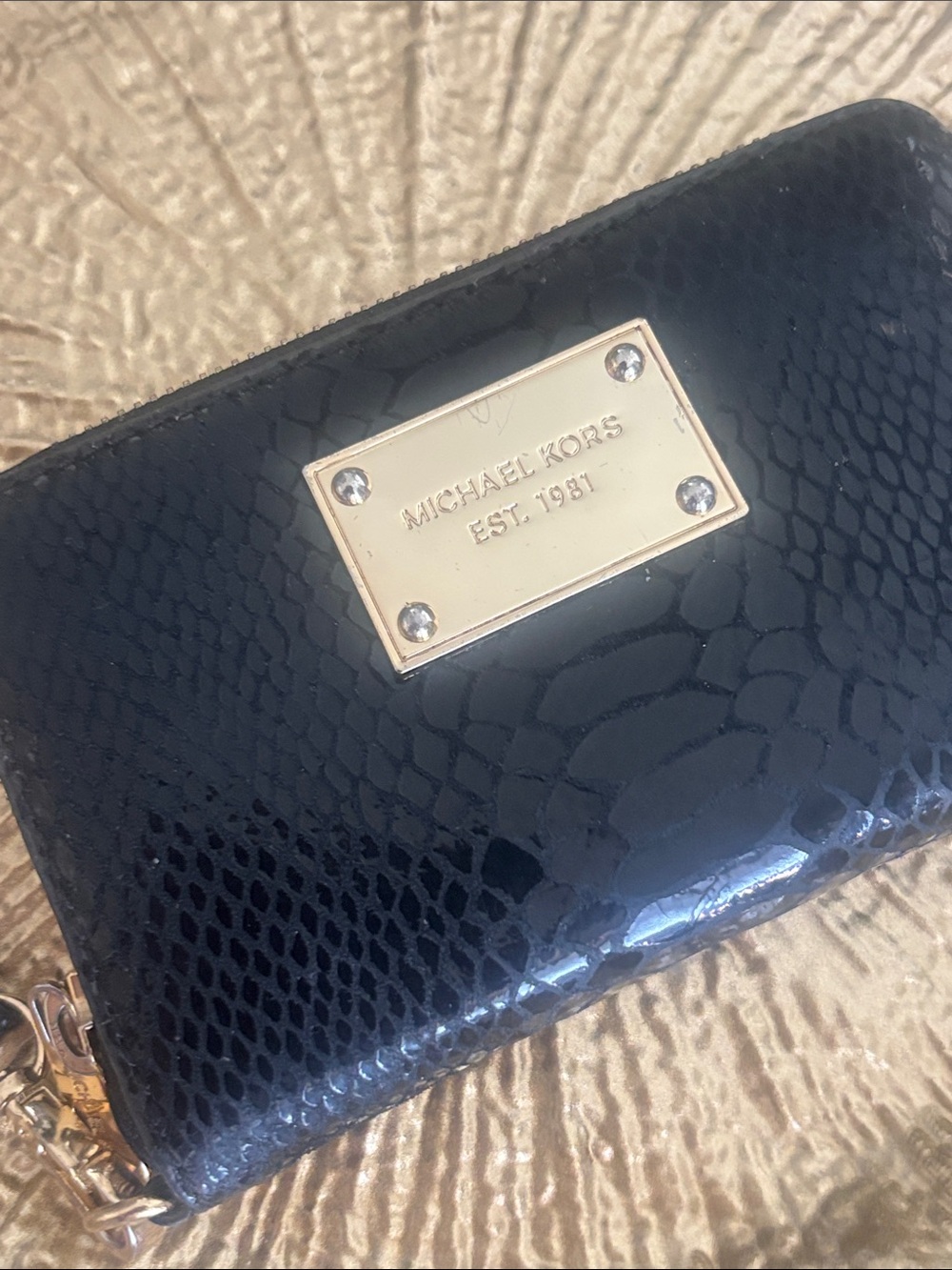 MICHAEL KORS Black Embossed Leather Wristlet with Gold Plate